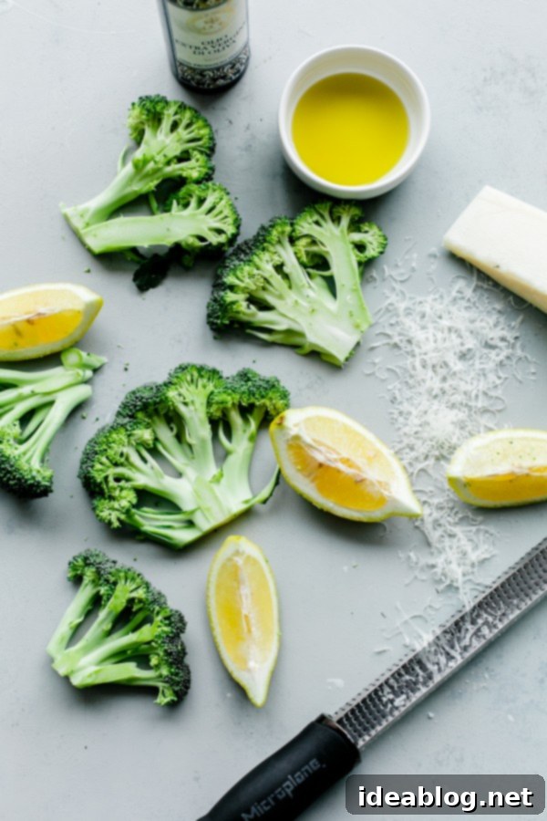 Effortlessly Delicious Roasted Broccoli 4 Close-up of roasted broccoli florets and 'steaks' with golden toasted almonds and grated Pecorino cheese.