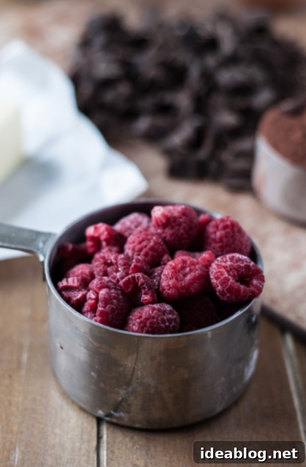 Decadent Dark Chocolate Chunk Raspberry Muffins 5 A bowl of frozen raspberries, key ingredient for the muffins