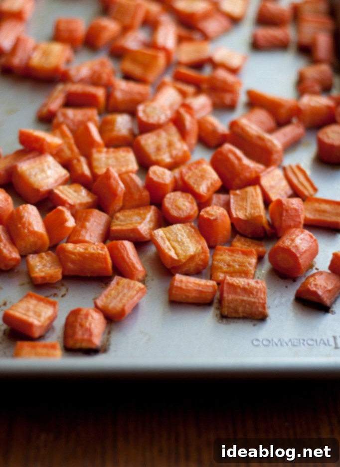 Golden Zesty Carrot Orange Muffins 3 Roasted Carrots on a Sheet Pan - Preparing for Muffins