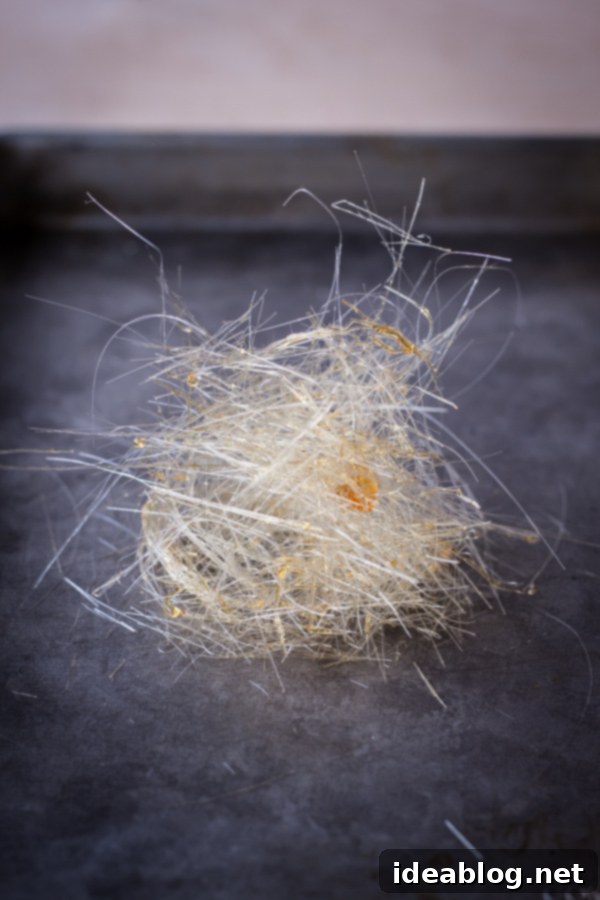 How to Make Spun Sugar: Shaping Delicate Nests and Garnishes for Desserts #spun_sugar #caramel_art #dessert_styling #sweet_decor Hand-formed Spun Sugar Nest for Dessert Decoration