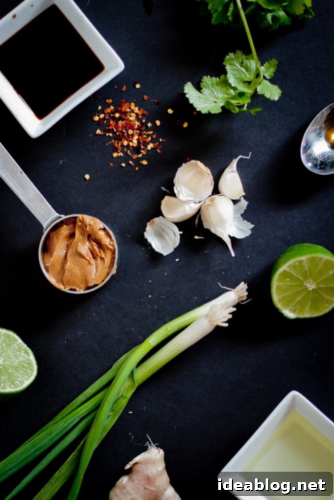 Umami Grilled Tofu Power Bowl 4 Close-up of the fresh ingredients used to make the grilled Asian tofu marinade, including ginger, garlic, and peanut butter